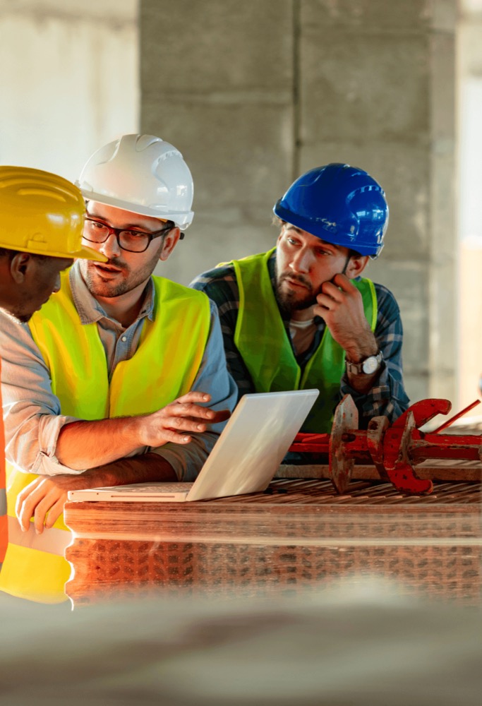 Infrastructure workers reviewing a project together